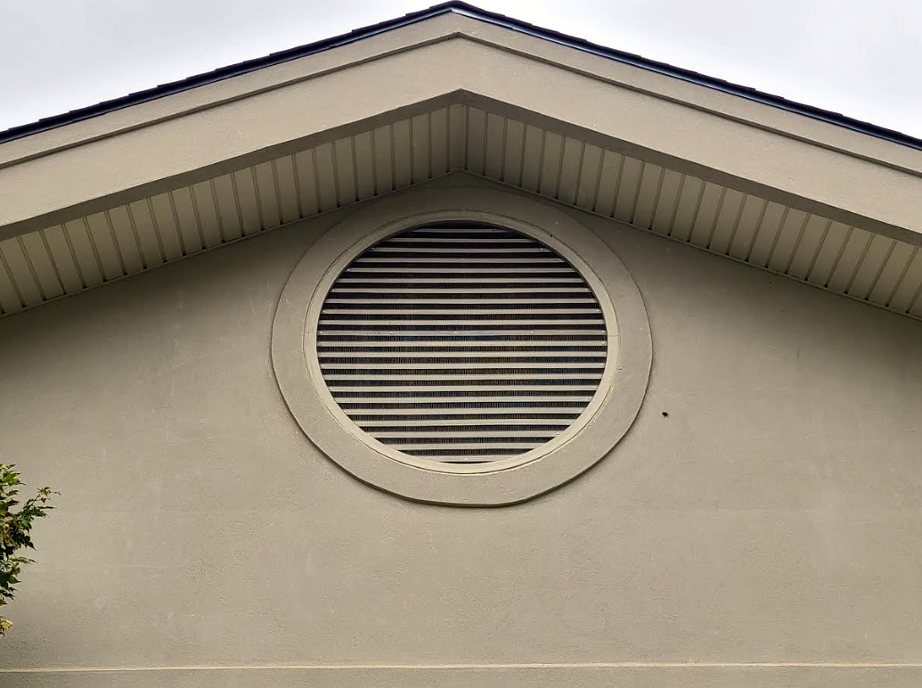 Completed wildlife exclusion work sealing a residential gable vent